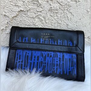 L.A.M.B. Black and Blue clutch